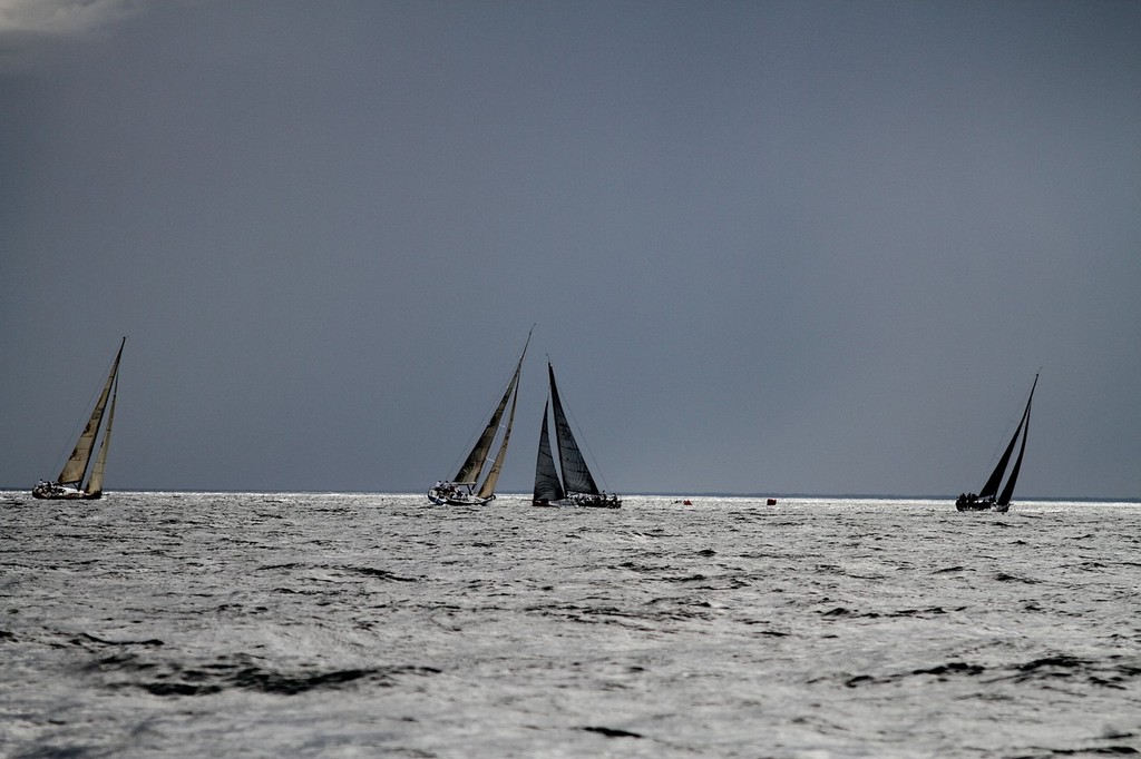 There was a great mix of conditions during the week.  Here yachts are racing against dark and stormy skies. © Bernie Kaaks
